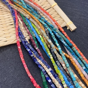 3mm natural stone cubic beads in various colors for DIY jewelry making on woven mat