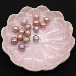 Lustrous multi-color Edison freshwater pearls 9-14mm in a pink floral ceramic dish