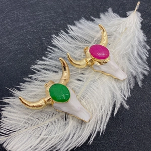 Bull skull pendant with green and pink natural stones in bohemian gold metal design