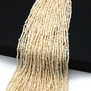 Detailed view of 2mm mini freshwater seed pearls with natural luster for DIY jewelry