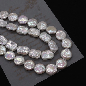 Macro detail of natural freshwater pearls showing high luster and iridescent reflections