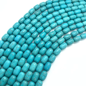 Détails macro de perles cylindriques en turquoise avec matrice pour bijoux DIY