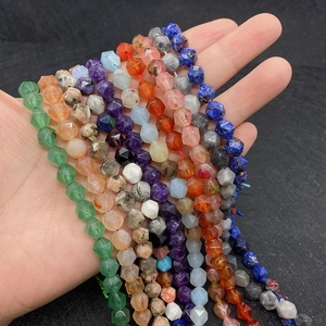 Macro shot of faceted natural stone beads including agate and amethyst for DIY jewelry