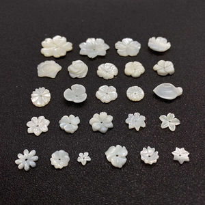 Collection of white mother of pearl hand-carved floral beads for DIY jewelry making