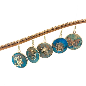 Natural stone drop earrings featuring butterfly and bee patterns on wooden branch