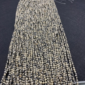 Close-up of faceted Dalmatian Jasper stone beads for DIY jewelry making accessories