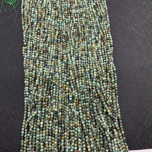 Macro shot of faceted African Turquoise natural stone beads for DIY jewelry making
