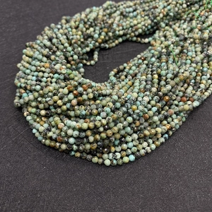 Detailed close-up of faceted African turquoise beads for DIY jewelry making