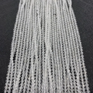 Macro detail of transparent faceted crystal round beads for DIY jewelry making