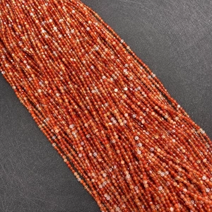 Macro shot of 2-4mm faceted natural red agate stone beads for DIY jewelry making