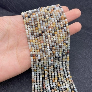 Close-up of faceted multi-colored natural stone beads for handmade DIY jewelry