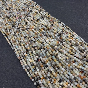Macro view of multi-colored faceted natural stone beads for DIY jewelry and bracelets