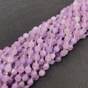 Macro view of lavender amethyst faceted beads with natural textures and hex prism shape