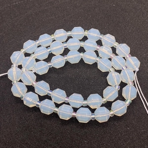 Macro shot of faceted milky white and iridescent crystal beads for DIY jewelry making