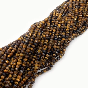 Macro detail of faceted natural tiger eye stone beads with golden silky luster for DIY