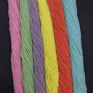 Macro view of 2mm faceted multi-color cat eye loose beads for jewelry making