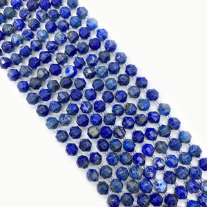 Macro view of faceted dark blue lapis lazuli semi-precious natural stone beads