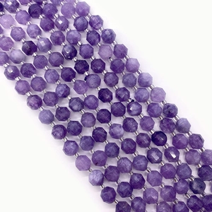 Macro shot of faceted purple amethyst beads showing geometric cut textures and luster