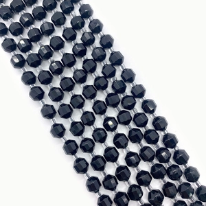 Macro detail of faceted black stone beads for DIY jewelry with light-reflecting surfaces