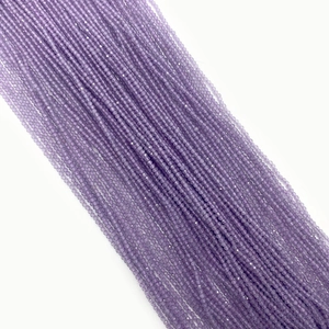 Macro shot of fine 2mm purple faceted opal cat eye stone beads for jewelry making