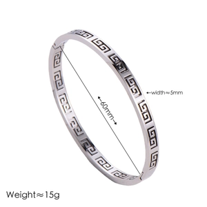Polished silver stainless steel bangle featuring hollow Greek Key pattern and secure clasp