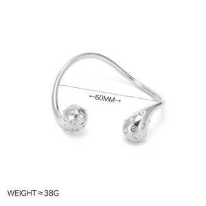 Elegant 18k gold plated open teardrop bangle featuring cubic zirconia pavé detailing