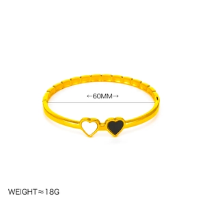 Bracciale a cuore in acciaio al titanio dorato con intarsio bianco e nero