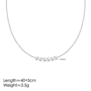 Λεπτομέρεια χρυσού κολιέ 18K με έξι πέρλες 5mm και πληροφορίες για τις διαστάσεις