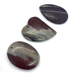 Detail view of water-drop, heart and oval shaped natural striped agate stone pendants