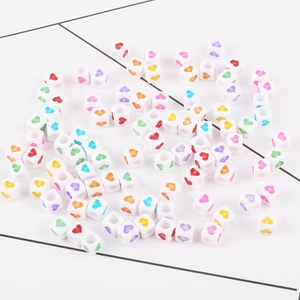 Colorful acrylic cube beads with heart patterns for DIY children jewelry making
