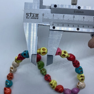 Macro shot measuring 10mm colorful skull-shaped stone beads for jewelry making