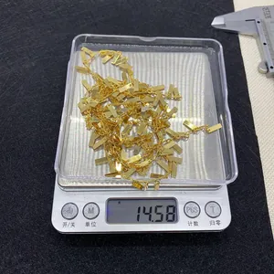 Precision measurement of a 14.58g gold chain with rectangular tags on a digital scale