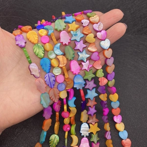 Rainbow dyed shell beads in heart, star, and moon shapes for DIY jewelry making