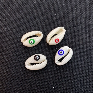Natural cowrie shells with evil eye prints in green red blue and black for DIY jewelry making