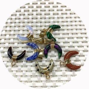 Natural crescent moon gemstone pendants with gold clasps in opal and malachite stones