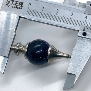 Macro view of 38mm blue sandstone gemstone pendant with silver metal fittings measured by caliper