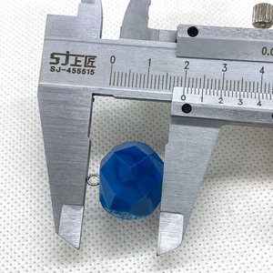 Measuring a 16mm blue faceted crystal stone pendant with a digital caliper tool