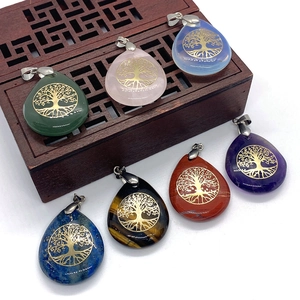 Teardrop gemstone pendants with golden Tree of Life engraving and silver bail charms