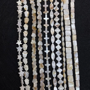 Assorted natural mother of pearl shell beads in star and flower shapes for DIY jewelry