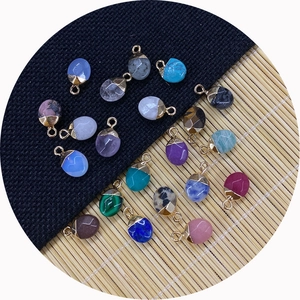 Star-shaped black onyx pendant with gold plated bezel and faceted natural stone details