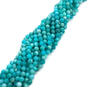 Macro shot of faceted natural amazonite beads in turquoise blue for DIY jewelry making