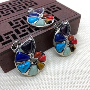 Natural gemstone snail pendant with seven chakra stones and polished silver metal plating