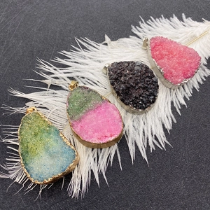 Teardrop crystal pendants with natural quartz texture and metallic electroplated edges