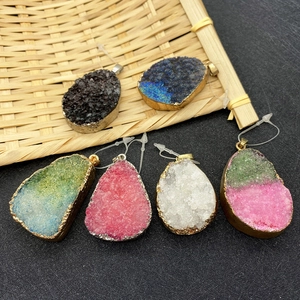 Set of irregular druzy crystal pendants with gold-plated edges in various colors