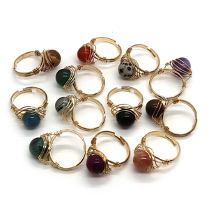 Detailed collection of handmade gold wire wrapped rings with various round natural gemstones
