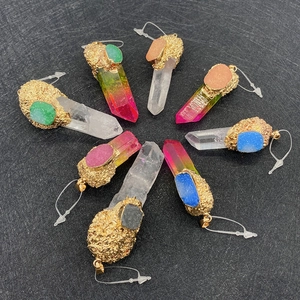 Set of 8 colorful natural crystal column pendants with gold plated edges on black background