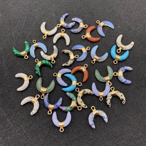 Detailed view of assorted crescent stone pendants with gold plating for DIY jewelry making