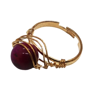 Handmade gold wire-wrapped ring featuring a natural 10mm round purple stone bead