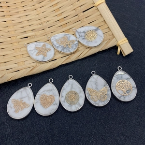 Set of eight white turquoise teardrop pendants with gold butterfly and heart engravings