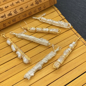 Handmade wire-wrapped pearl and crystal cylinder pendants with gold and silver finishes